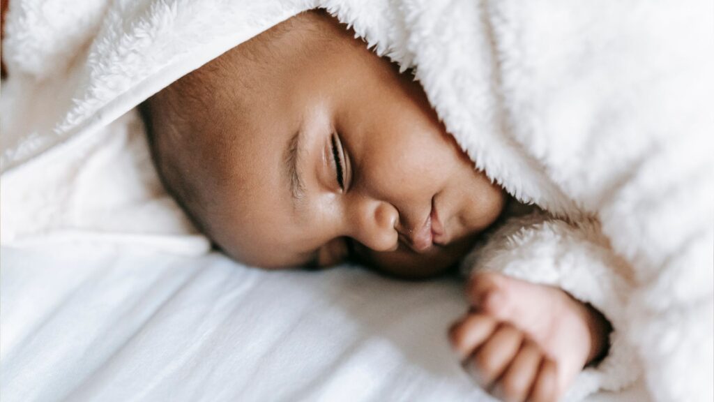A baby sleeping peacefully after learning to self-soothe