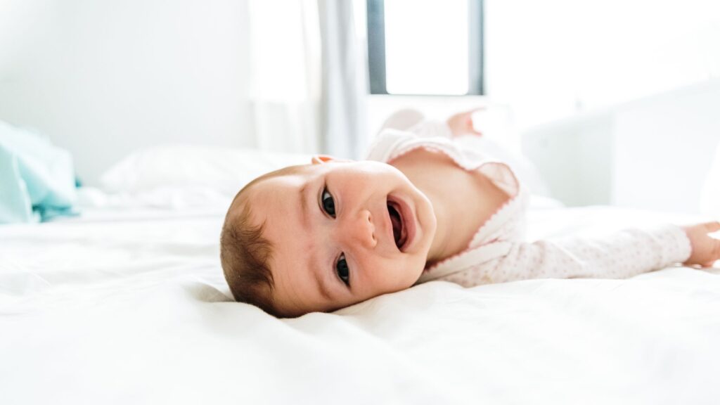 Baby rolling over milestone - baby reaching developmental milestone